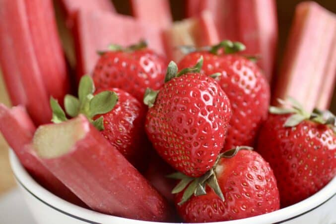 fresh strawberries and rhubarb in a bowl