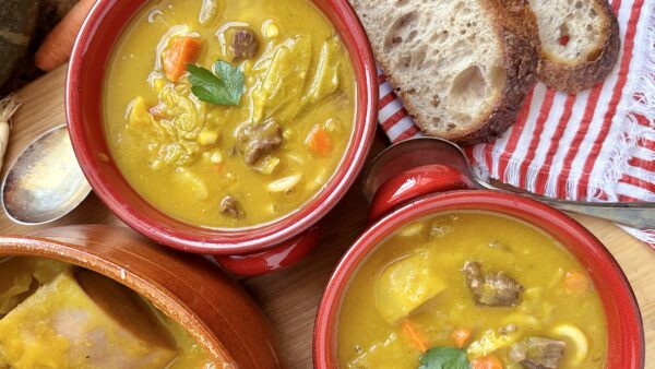 soup joumou in red bowls overhead