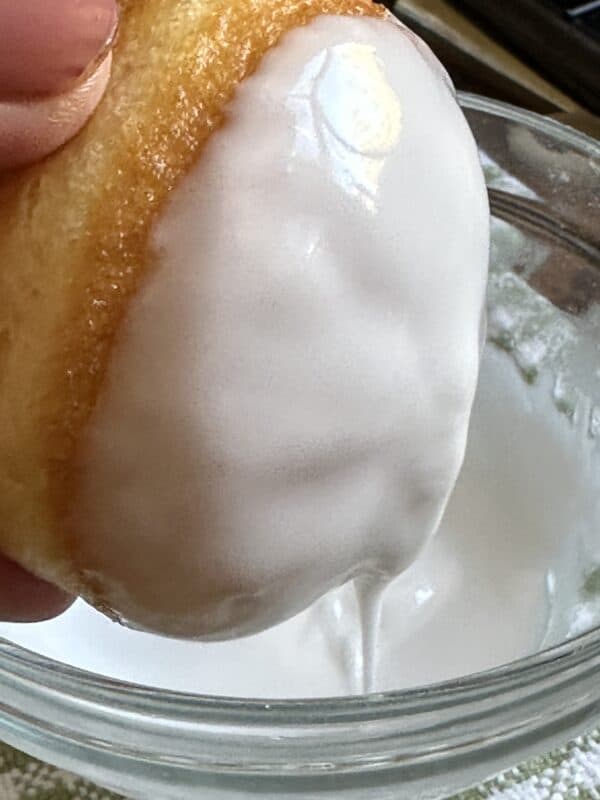 glazing the top of a doughnut