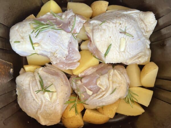 potatoes and chicken in an air fryer