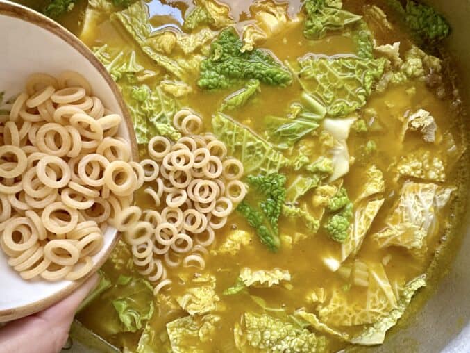 adding pasta to soup joumou
