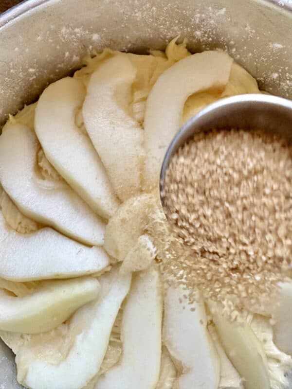 sprinkling Demerara sugar on top of pears