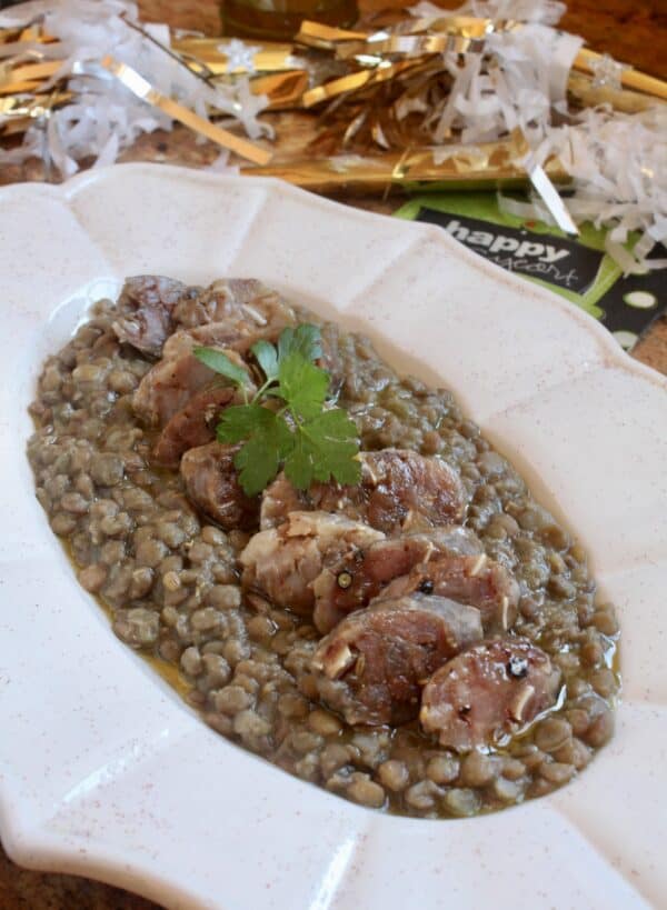 cotechino and lentils on a serving platter