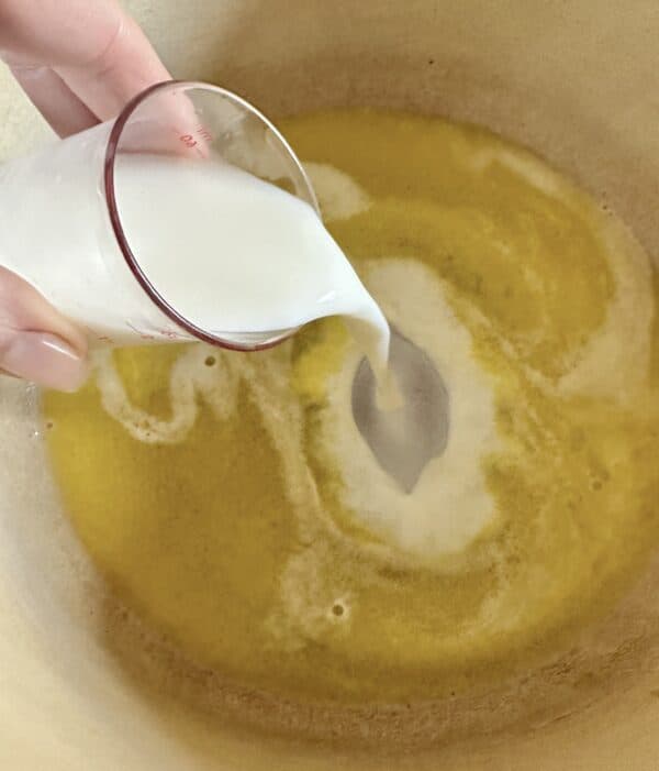 adding milk to butter and water