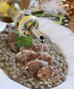adding oil to cotechino and lentils