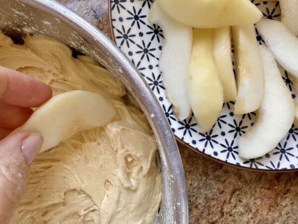 adding pears to top of cake