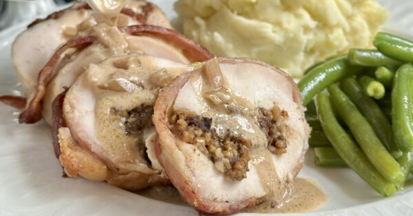 pouring whisky sauce on chicken pouring whisky sauce on chicken