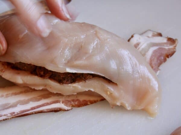 wrapping bacon around the chicken breast