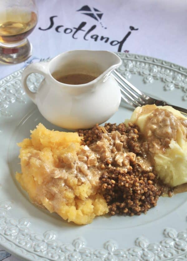 haggis, neeps and tatties with jug of whisky sauce and a wee dram