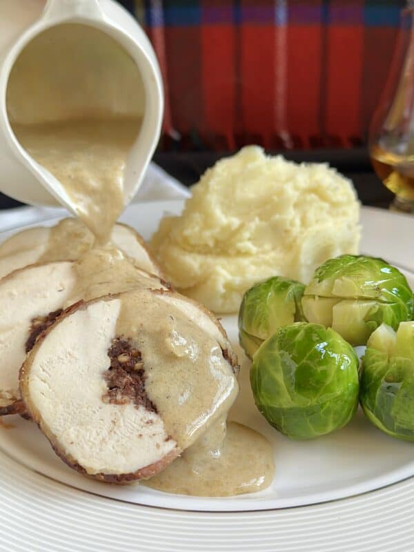 pouring whisky sauce on chicken braemar