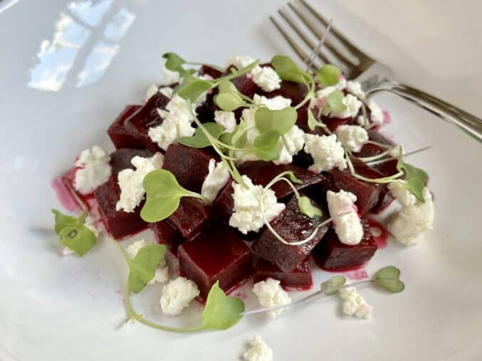 Beet and goat cheese salad with fork