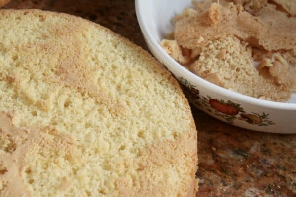 trimming off all the colored parts of the sponge cake