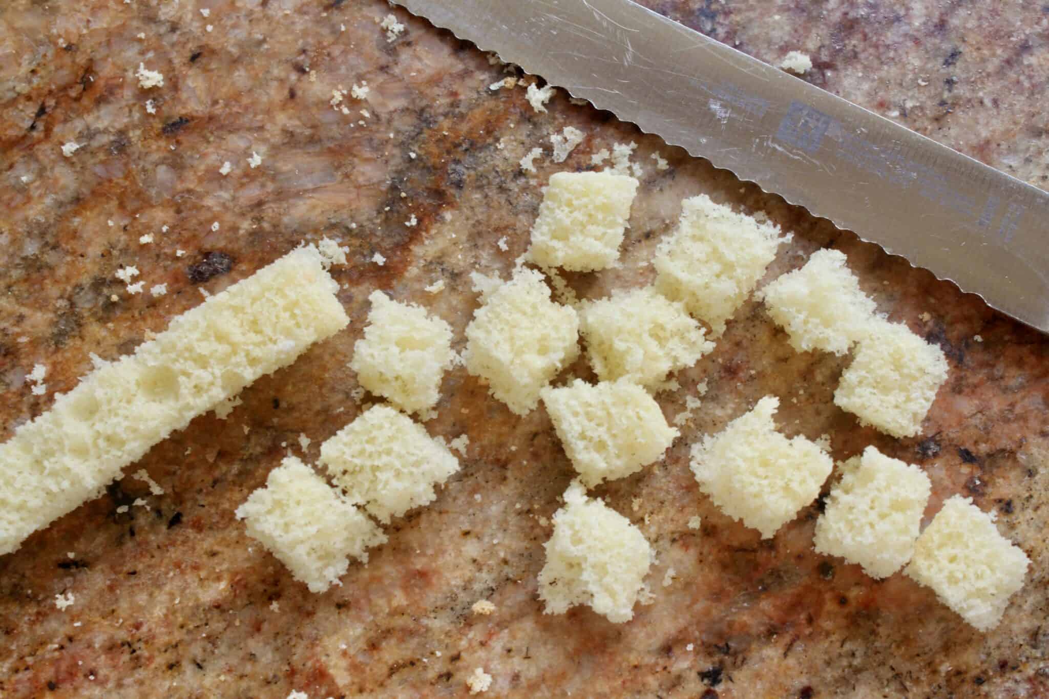 making cubes of sponge cake