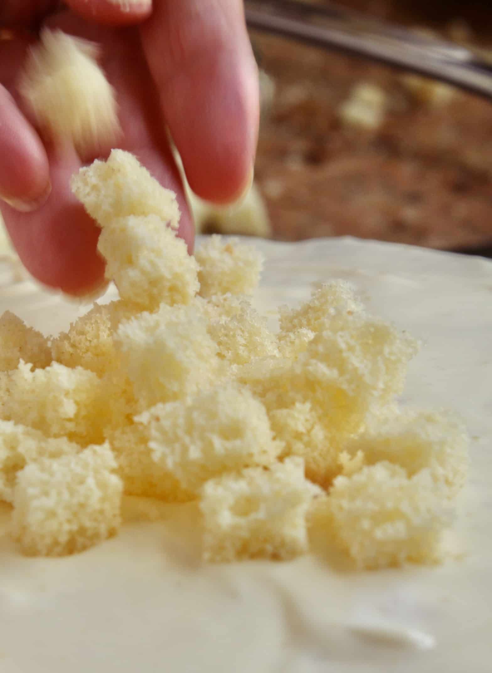 tossing cake cubes onto International women's day cake