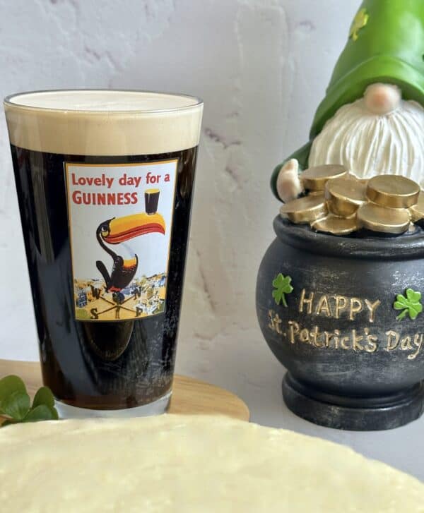 Guinness in a glass with a leprechaun