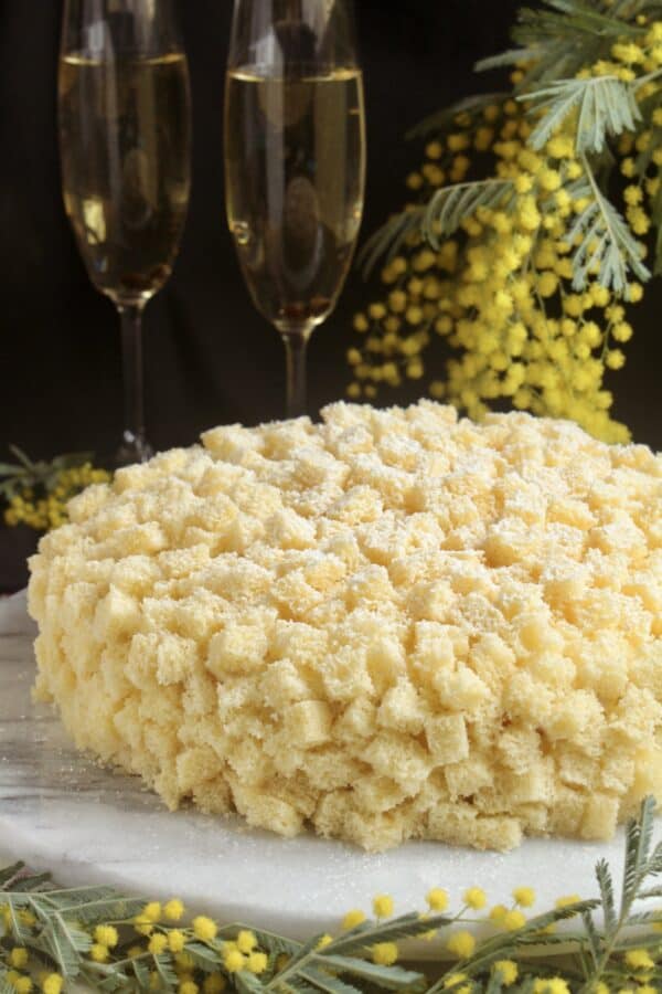 international Women's Day cake with mimosa and glasses