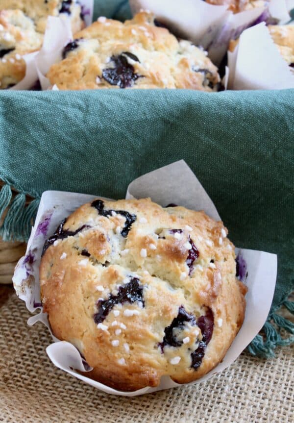 blueberry muffin next to basket