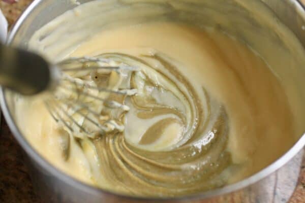 adding cream of pistachio to crema