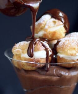 pouring sauce on profiteroles