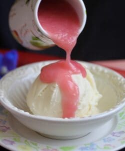 pouring rhubarb sauce over ice cream