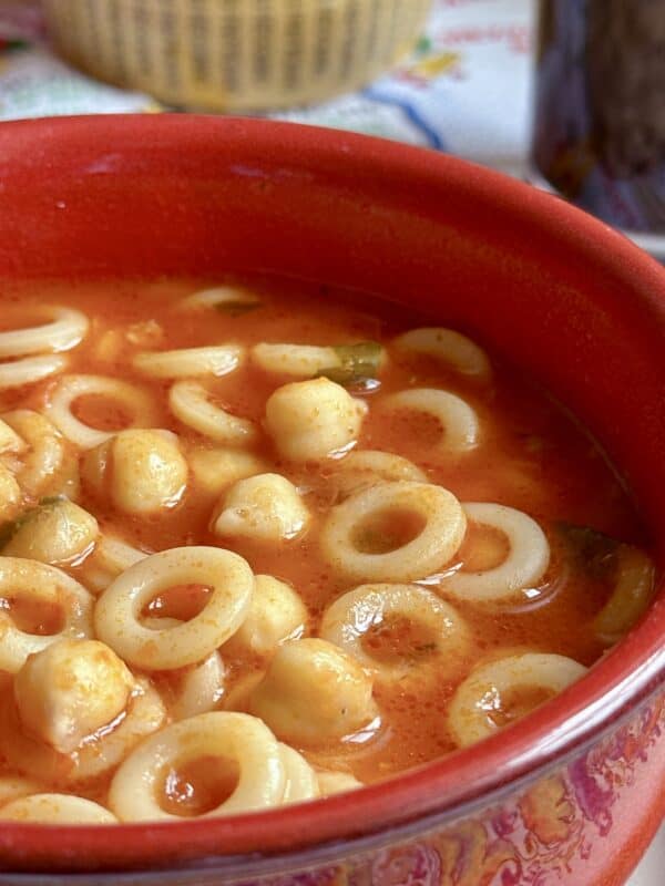 pasta e ceci in a red bowl