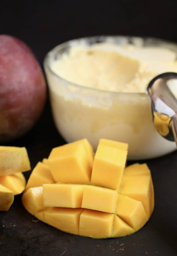 mango cut in half and cubed with mango ice cream