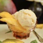 mango ice cream with slices of mango