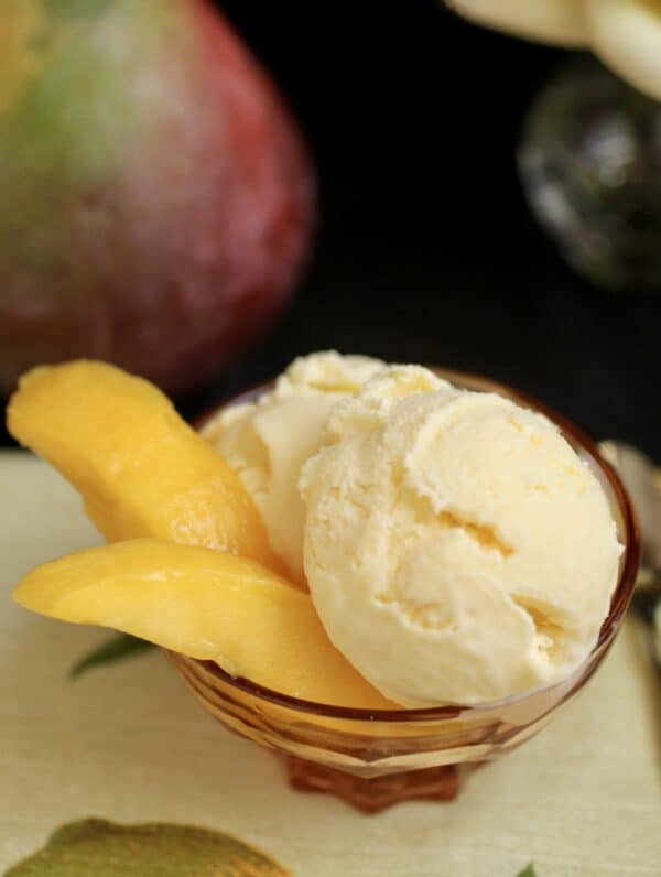 mango ice cream with slices of mango