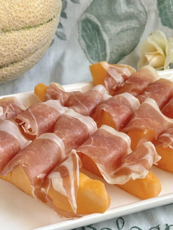 prosciutto with melon on plate