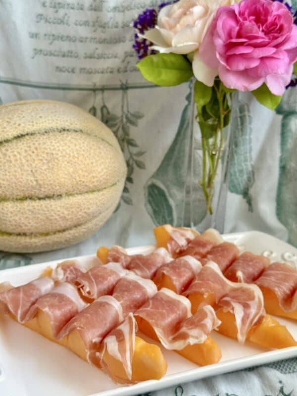 prosciutto with melon on plate