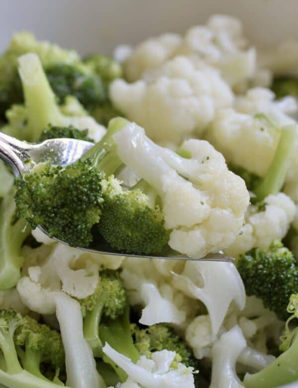 broccoli and cauliflower salad on a fork