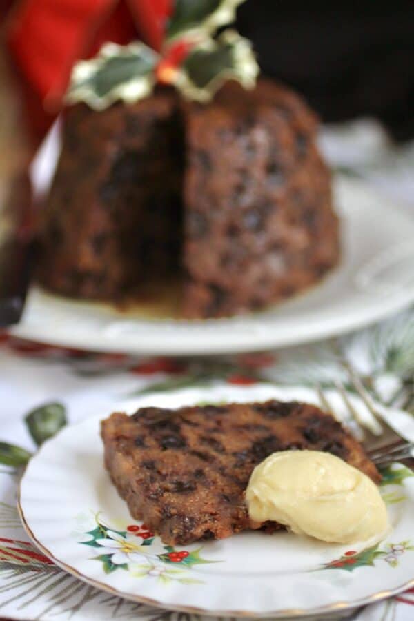 sliced Christmas pudding and butter with brandy