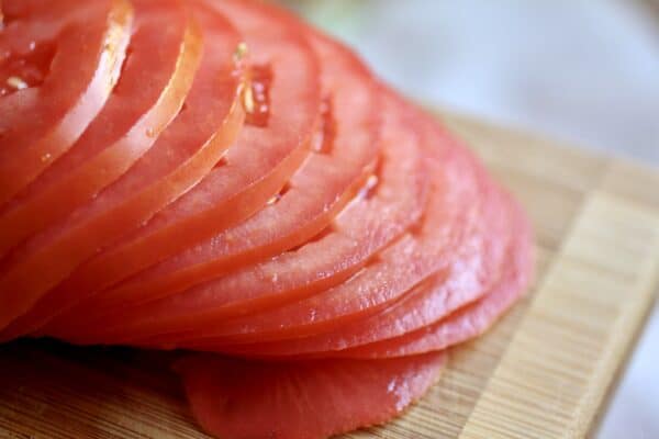 thinly sliced tomato