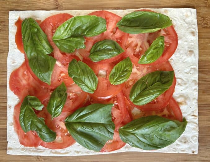 making Caprese pinwheel sandwiches