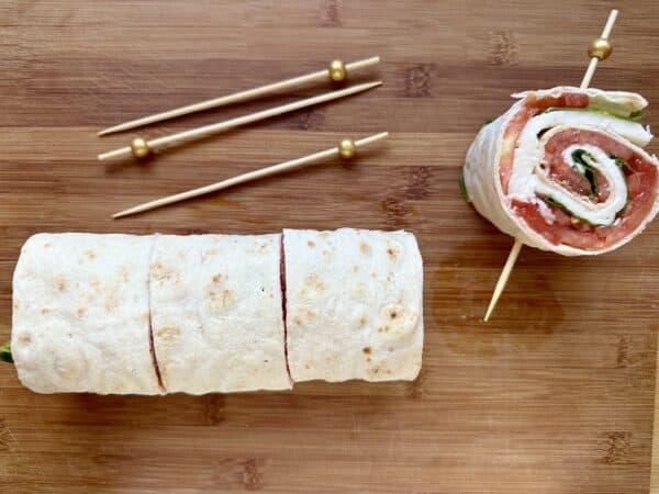 skewering pinwheel sandwiches 