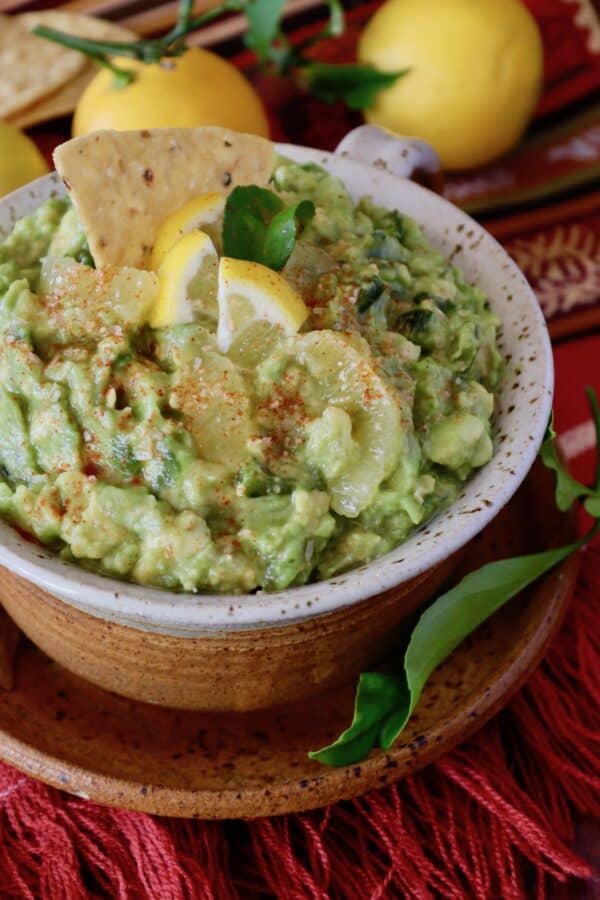 Poblano Guacamole with Lemon in a bowl for best tailgate party food