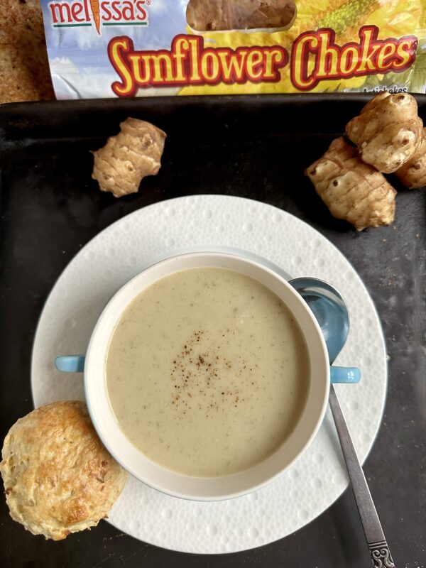 sunchoke soup with scone on plate