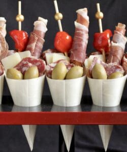 charcuterie cups in a stand