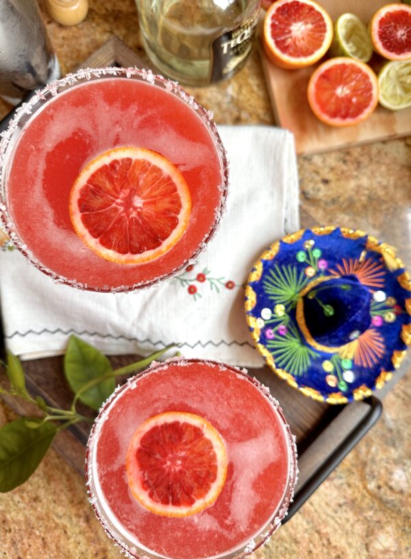 overhead margaritas with orange slices in each one