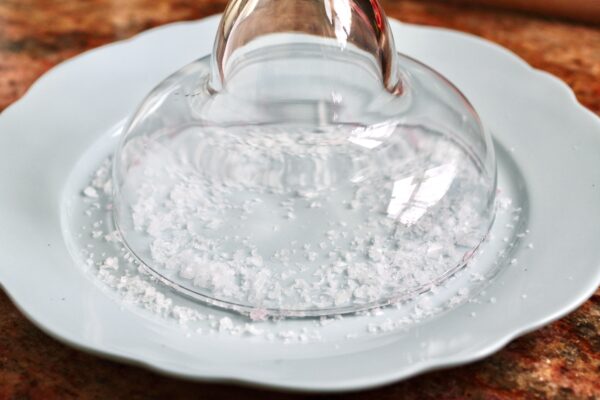 rimming margarita glass with coarse salt