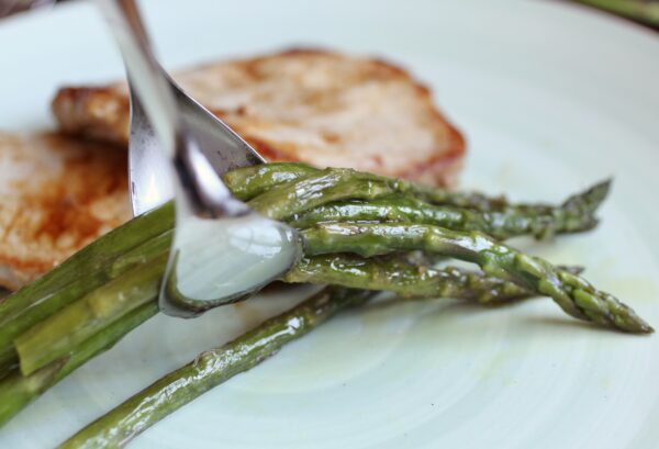 putting asparagus on a plate