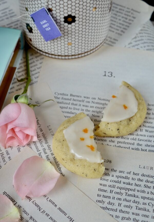 earl grey cookies on book pages with rose