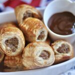 Sausage rolls recipe mini ones in bowl with HP Sauce