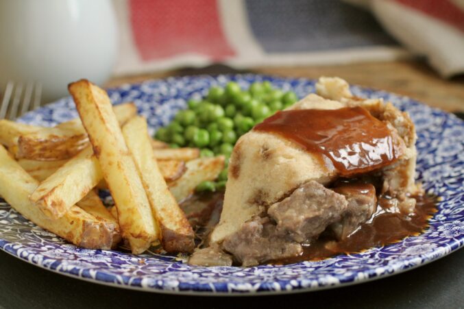 steak pudding with gravy and chips