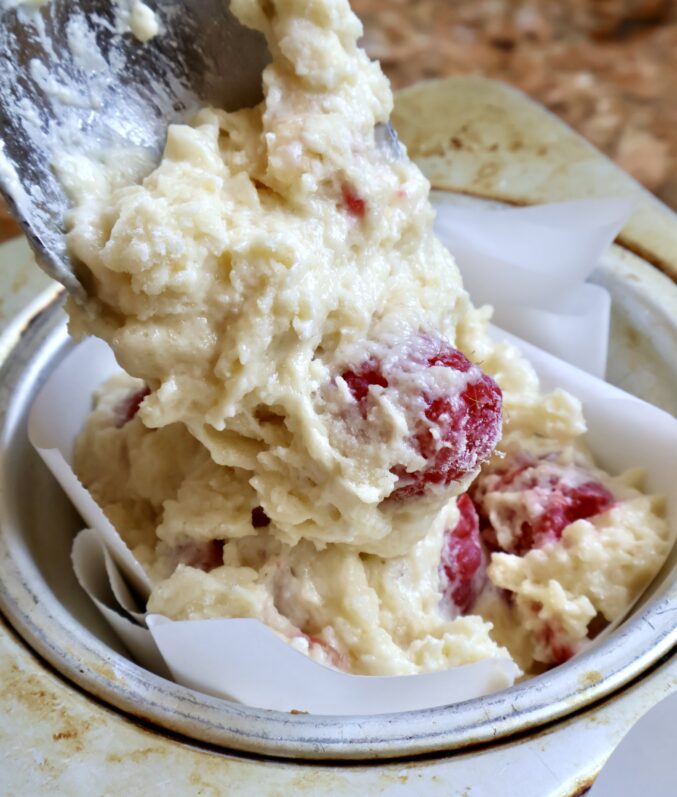 spooning batter into tray