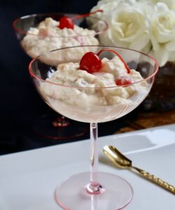 glorified rice in pink glasses with cherries on top