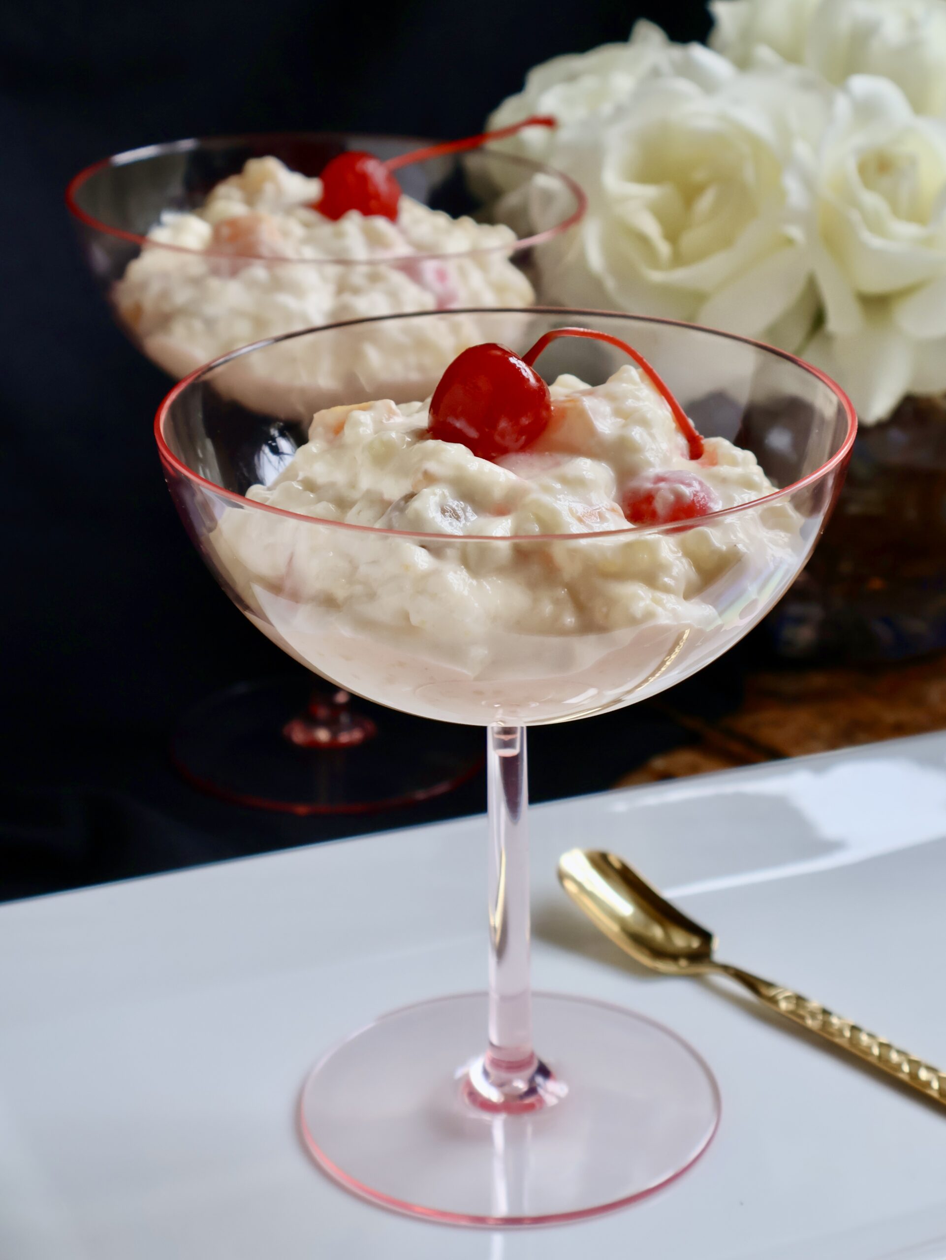 glorified rice in pink glasses with cherries on top
