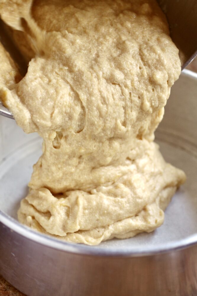 pouring cake batter into tray
