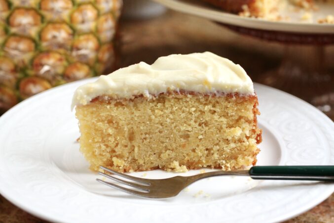 slice of cake with cream cheese frosting
