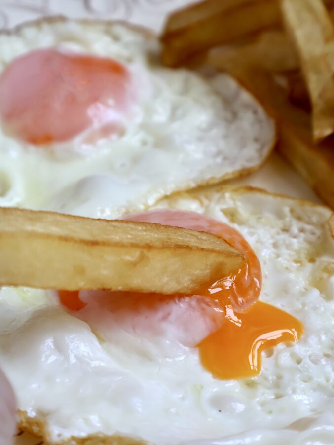 dipping into an egg yolk